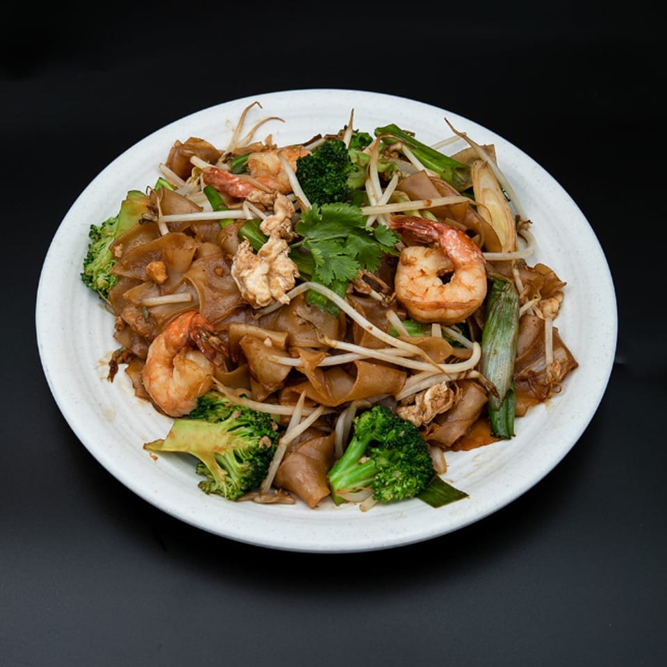 Hiccups' Asian-fusion stir-fried noodles with shrimp, broccoli, bean sprouts, and green onions.