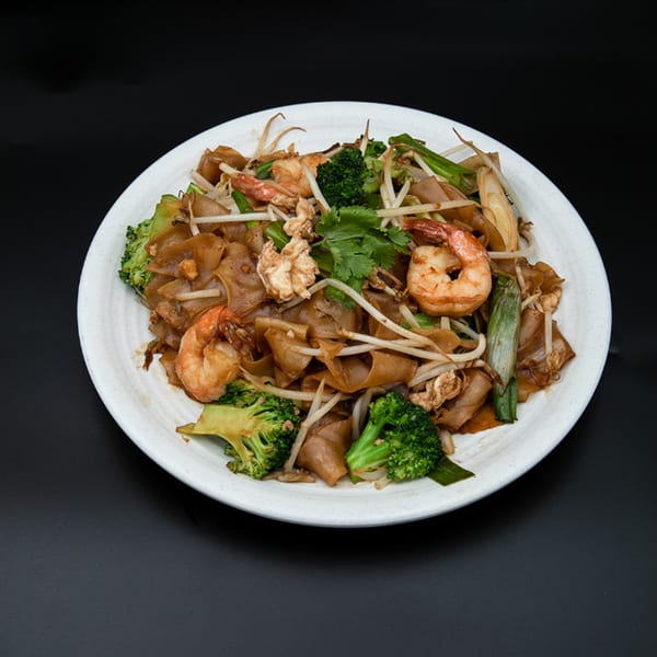 Hiccups' Asian-fusion dish with flat noodles, shrimp, broccoli, bean sprouts, and green onions.